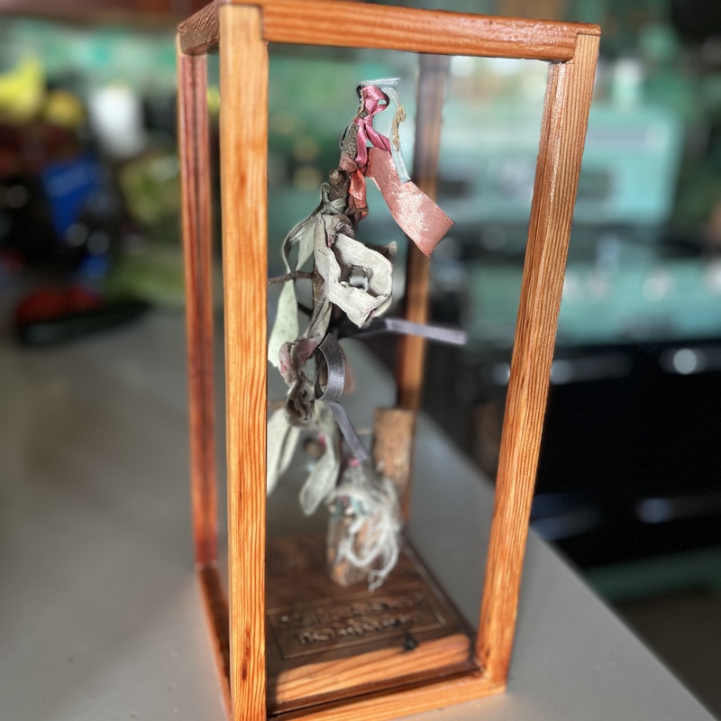 Custom case for ribbon branch, made from lumber taken from the house itself.